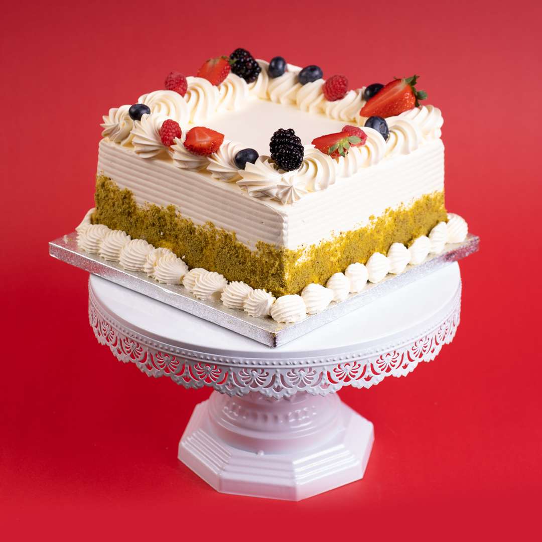 White Swirl Pistachio Delight Cake